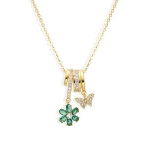 Gold green flower necklace with gold butterfly